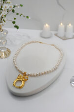 Doğal 7×8 mm inci kolye – gold çelik zincir – çeyrek altın çerçevesi